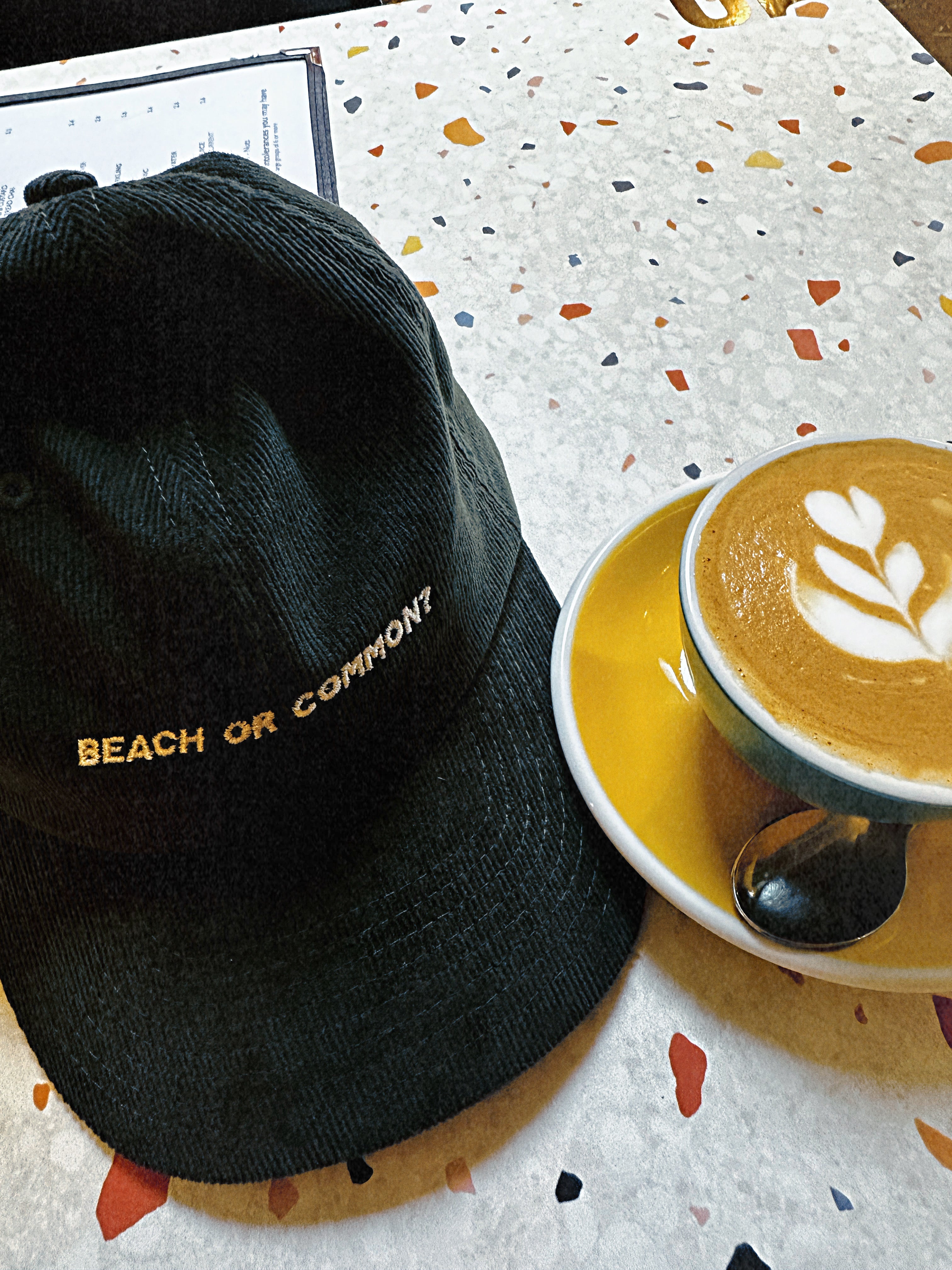 Flat white with swan latter art